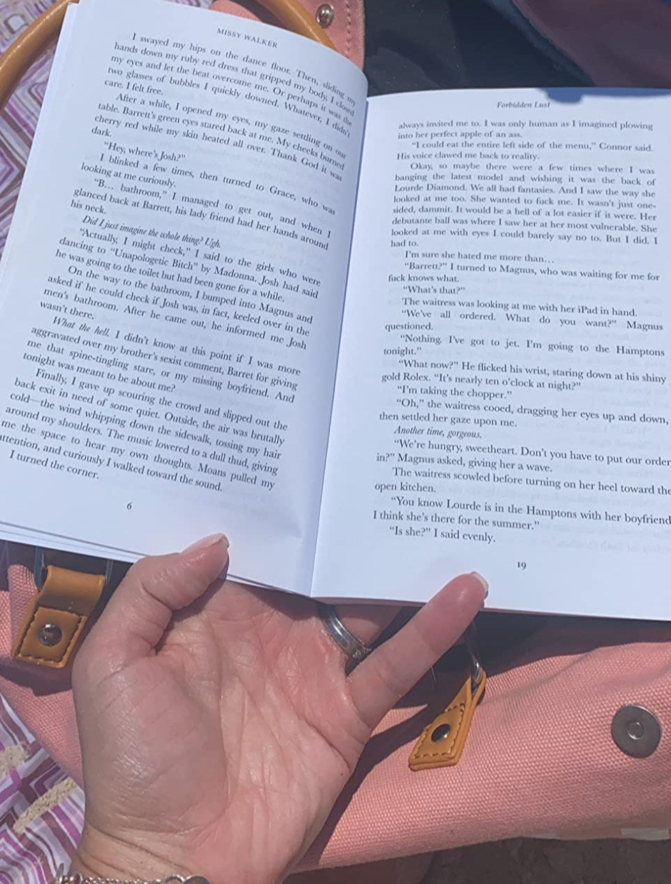 Reader photo with paperback on beach